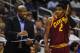 Oct 11, 2013; Orlando, FL, USA; Cleveland Cavaliers head coach Mike Brown talks with point guard Kyrie Irving (2) during the first quarter during game against the Orlando Magic at Amway Center. Mandatory Credit: David Manning-USA TODAY Sports