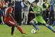 TORONTO, CANADA - AUGUST 10: Doneil Henry #4 of the Toronto FC defends as Clint Dempsey #2 of the Seattle Sounders FC runs with the ball during MLS game action August 10, 2013 at BMO Field in Toronto, Ontario, Canada. (Photo by Brad White/Getty Images)