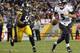 PITTSBURGH, PA - OCTOBER 20: Joe Flacco #5 of the Baltimore Ravens scrambles out of the pocket against LaMarr Woodley #56 of the Pittsburgh Steelers during the game on October 20, 2013 at Heinz Field in Pittsburgh, Pennsylvania. (Photo by Justin K. Alle