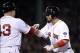 Oct 30, 2013; Boston, MA, USA; Boston Red Sox right fielder Shane Victorino (right) is congratulated by first base coach Arnie Beyeler (43) after hitting a RBI single against the St. Louis Cardinals in the fourth inning during game six of the MLB baseball