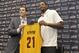 INDEPENDENCE, OH - JULY 19: Andrew Bynum holds up his new jersey as he is introduced as a new addition to the Cleveland Cavaliers alongside general manager Chris Grant at The Cleveland Clinic Courts on July 19, 2013 in Independence, Ohio in Cleveland, Oh