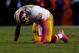 DENVER, CO - OCTOBER 27: Quarterback Robert Griffin III #10 of the Washington Redskins goes to his knees after throwing an interception during the fourth quarter against the Denver Broncos at Sports Authority Field Field at Mile High on October 27, 2013