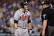 LOS ANGELES, CA - OCTOBER 07: Brian McCann #16 of the Atlanta Braves reacts after a called third strike in the second inning with umpire Bill Miller against the Los Angeles Dodgers in Game Four of the National League Division Series at Dodger Stadium on