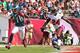 TAMPA, FL - OCTOBER 13: DeSean Jackson #10 of the Philadelphia Eagles catches a touchdown pass over Darrelle Revis #24 of the Tampa Bay Buccaneers during a game at Raymond James Stadium on October 13, 2013 in Tampa, Florida. (Photo by Mike Ehrmann/Getty