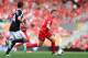 LIVERPOOL, ENGLAND - SEPTEMBER 21: Jordan Henderson of Liverpool moves away from Morgan Schneiderlin of Southampton during the Barclays Premier League match between Liverpool and Southampton at Anfield on September 21, 2013 in Liverpool, England. (Photo