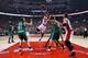 TORONTO, ON - OCTOBER 30: DeMar DeRozan #10 of the Toronto Raptors drives to the basket as both Kelly Olynyk #41 and Vitor Faverani #38 of the Boston Celtics defend and teammate Jonas Valanciunas #17 of the Toronto Raptors looks on during their NBA game