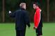 MANCHESTER, ENGLAND - OCTOBER 22: David Moyes the manager of Manchester United talks with Robin Van Persie prior to a training session at Aon Training Complex on October 22, 2013 in Manchester, England. (Photo by Alex Livesey/Getty Images)