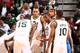 SALT LAKE CITY, UT - OCTOBER 30: Mike Harris #33 of the Utah Jazz talks to teammates Derrick Favors #15, Alec Burks #10 and Rudy Gobert #27 during a timeout against the Oklahoma City Thunder at EnergySolutions Arena on October 30, 2013 in Salt Lake City,