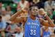 SALT LAKE CITY, UT - OCTOBER 30: Kevin Durant #35 of the Oklahoma City Thunder, who was the leading scorer in their game against the Utah Jazz with 42 points, listens to head coach Scott Brooks at EnergySolutions Arena October 30, 2013 in Salt Lake City,