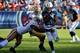 NASHVILLE, TN - OCTOBER 20: Chris Johnson #28 of the Tennessee Titans carries the ball against the San Francisco 49ers at LP Field on October 20, 2013 in Nashville, Tennessee. (Photo by Frederick Breedon/Getty Images)