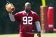 ASHBURN, VA - AUGUST 06: Defensive lineman Albert Haynesworth #92 of the Washington Redskins walks off the field after missing his eighth consecutive day of practice during Redskins training camp on August 6, 2010 in Ashburn, Virginia. (Photo by Win McN