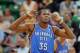 SALT LAKE CITY, UT - OCTOBER 30: Kevin Durant #35 of the Oklahoma City Thunder, who was the leading scorer in their game against the Utah Jazz with 42 points, listens to head coach Scott Brooks at EnergySolutions Arena October 30, 2013 in Salt Lake City,