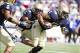 Oct 5, 2013; Annapolis, MD, USA; Navy Midshipmen linebacker Chris Johnson (46) runs after intercepting a pass by Air Force Falcons quarterback Karson Roberts (not pictured) during the second half at Navy Marine Corps Memorial Stadium. Mandatory Credit: Pa