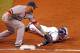ST. PETERSBURG - MAY 16: Outfielder Matt Joyce #20 of the Tampa Bay Rays slides under the tag from first baseman Mike Napoli #12 of the Boston Red Sox during the game at Tropicana Field on May 16, 2013 in St. Petersburg, Florida. (Photo by J. Meric/Gett
