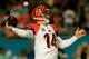 MIAMI GARDENS, FL - OCTOBER 31: Andy Dalton #14 of the Cincinnati Bengals attempts to pass the ball against the Miami Dolphins at Sun Life Stadium on October 31, 2013 in Miami Gardens, Florida. (Photo by Chris Trotman/Getty Images)