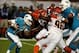 Oct 31, 2013; Miami Gardens, FL, USA; Miami Dolphins quarterback Ryan Tannehill (17) is sacked by Cincinnati Bengals defensive tackle Geno Atkins (back) as defensive end Carlos Dunlap (96) gets past Dolphins tackle Tyson Clabo (77) in the first quarter a