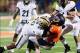 Nov 17, 2012; Champaign, IL, USA; Illinois Fighting Illini quarterback Nathan Scheelhaase (2) is tackled by Purdue Boilermakers defensive tackle Bruce Gaston (90) during the fourth quarter at Memorial Stadium. Mandatory Credit: Bradley Leeb-USA TODAY Spo
