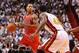 Oct 29, 2013; Miami, FL, USA; Chicago Bulls point guard Derrick Rose (1) dribbles against the Miami Heat power forward Udonis Haslem (40) during the first quarter at American Airlines Arena. Mandatory Credit: Steve Mitchell-USA TODAY Sports