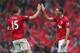MANCHESTER, ENGLAND - MAY 12: Rio Ferdinand of Manchester United celebrates scoring the winning goal with team-mate Nemanja Vidic during the Barclays Premier League match between Manchester United and Swansea City at Old Trafford on May 12, 2013 in Manch