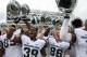 IOWA CITY, IOWA - OCTOBER 5: Defensive end Shilique Calhoun #89, Jermaine Edmondson #39 and Matt Macksood #86 of the Michigan State Spartans sing their fight song after their match-up against the Iowa Hawkeyes on October 5, 2013 at Kinnick Stadium in Iow