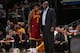 CLEVELAND, OH - OCTOBER 30: Kyrie Irving #2 and head coach Mike Brown of the Cleveland Cavaliers speak on court against the Brooklyn Nets during a game at the Quicken Loans Arena on October 30, 2013 in Cleveland, Ohio. NOTE TO USER: User expressly acknowl