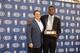INDEPENDENCE, OH - MAY 15: Owner Dan Gilbert and Kyrie Irving #2 of the Cleveland Cavaliers poses for a portrait as Kyrie is the recipient of the Eddie Gottlieb Trophy as the 2011-12 Kia NBA Rookie of the Year on May 15, 2012 at Cleveland Clinic Courts in