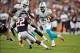 Aug 17, 2013; Houston, TX, USA; Miami Dolphins running back Daniel Thomas (33) runs past Houston Texans cornerback Roc Carmichael (22) during the first half at Reliant Stadium. Mandatory Credit: Jerome Miron-USA TODAY Sports