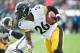 Oct 27, 2013; Oakland, CA, USA; Pittsburgh Steelers running back Le'Veon Bell (26) runs with the ball during the second quarter of the game against the Oakland Raiders at O.co Coliseum. Mandatory Credit: Ed Szczepanski-USA TODAY Sports