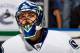 UNIONDALE, NY - OCTOBER 22: Roberto Luongo #1 of the Vancouver Canucks skates in warm-ups prior to the game against the New York Islanders at the Nassau Veterans Memorial Coliseum on October 22, 2013 in Uniondale, New York. The Canucks defeated the Islan