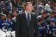 VANCOUVER, CANADA - JANUARY 19: Vancouver Canucks General Manager Mike Gillis stands in front of the bench during their season-opening NHL game against the Anaheim Ducks at Rogers Arena January 19, 2013 in Vancouver, British Columbia, Canada. (Photo by Je
