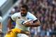 LONDON, ENGLAND - NOVEMBER 02: Billy Vunipola of England is tackled by Will Genia of Australia during the QBE International match between England and Australia at Twickenham Stadium on November 2, 2013 in London, England. (Photo by Warren Little/Getty I