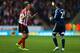 HULL, ENGLAND - NOVEMBER 02: Vito Mannone of Sunderland (R) speaks with team-mate John O'Shea during the Barclays Premier League match between Hull City and Sunderland at KC Stadium on November 2, 2013 in Hull, England. (Photo by Matthew Lewis/Getty Ima