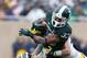 EAST LANSING, MI - NOVEMBER 02: Desmond Morgan #48 and Joe Bolden #35 of the Michigan Wolverines bring down Jeremy Langford #33 of the Michigan State Spartans in the second quarter at Spartan Stadium on November 2, 2013 in East Lansing, Michigan. (Photo