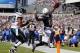 PHILADELPHIA, PA - SEPTEMBER 15: Wide receiver Eddie Royal #11 of the San Diego Chargers jumps into the end zone after making a catch for a 24 yard touchdown as cornerback Cary Williams #26 of the Philadelphia Eagles defends during the third quarter at Li
