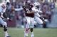 HOUSTON, TX - OCTOBER 19: Johnny Manziel #2 of the Texas A&M Aggies rushes past Gabe Wright #90 of the Auburn Tigers on October 19, 2013 at Kyle Field in College Station, Texas. Auburn Tigers won 45 to 41.(Photo by Thomas B. Shea/Getty Images)