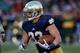 SOUTH BEND, IN - NOVEMBER 02: Cam McDaniel #33 of the Notre Dame Fighting Irish runs for a touchdown against the Navy Midshipmen at Notre Dame Stadium on November 2, 2013 in South Bend, Indiana. Notre Dame defeated Navy 38-34. (Photo by Jonathan Daniel/Ge