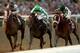 ARCADIA, CA - NOVEMBER 02: Mucho Macho Man (right), riden by Gary Stevens crosses the finish line ahead of Will Take Charge, riden by Luis Saez and Declaration of War, riden by Joseph O'Brien, to win the Breeders' Cup Classic during the 2013 Breeders' Cu