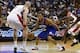 Nov 1, 2013; Washington, DC, USA; Philadelphia 76ers small forward Evan Turner (12) dribbles the ball between Washington Wizards center Marcin Gortat (4) and Wizards small forward Martell Webster (9) in the third quarter at Verizon Center. The 76ers won 1