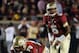 Nov 2, 2013; Tallahassee, FL, USA; Florida State Seminoles quarterback Jameis Winston (5) prepares to take the snap from center Josue Matias (70) during the game against the Miami Hurricanes at Doak Campbell Stadium. Mandatory Credit: Melina Vastola-USA T