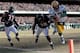 CHICAGO, IL - JANUARY 23: Quarterback Aaron Rodgers #12 of the Green Bay Packers dives into the corner of the endzone for a one-yard touchdown run against Danieal Manning #38 of the Chicago Bears in the first quarter of the NFC Championship Game at Soldi