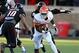 Nov 2, 2013; Lubbock, TX, USA; Oklahoma State Cowboys running back Desmond Roland (26) rushes against the Texas Tech Red Raiders in the first quarter at Jones AT&T Stadium. Mandatory Credit: Michael C. Johnson-USA TODAY Sports