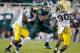EAST LANSING, MI - NOVEMBER 02: Bennie Fowler #13 of the Michigan State Spartans tries to avoid Raymon Taylor #6 and Thomas Gordon #30 of the Michigan Wolverines during the fourth quarter at Spartan Stadium on November 2, 2013 in East Lansing, Michigan. M