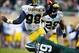 Nov 2, 2013; East Lansing, MI, USA; Michigan Wolverines quarterback Devin Gardner (98) is sacked by Michigan State Spartans defensive end Shilique Calhoun (89) during the 2nd half of a game at Spartan Stadium. MSU won 29-6. Mandatory Credit: Mike Carter-U