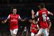 LONDON, ENGLAND - OCTOBER 01: Mesut Oezil #11of Arsenal is congratulated by teammate Aaron Ramsey #16 after scoring the opening goal during UEFA Champions League Group F match between Arsenal FC and SSC Napoli at Emirates Stadium on October 1, 2013 in L