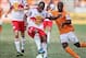 Oct 20, 2013; Houston, TX, USA; New York Red Bulls defender Jamison Olave (4) and Houston Dynamo forward Omar Cummings (7) battle for the ball during the second half at BBVA Compass Stadium. The Red Bulls defeated the Dynamo 3-0. Mandatory Credit: Troy Ta