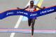 NEW YORK, NY - NOVEMBER 03: Geoffrey Mutai of Kenya crosses the finish line in Central Park to win the 2013 ING New York City Marathon on November 3, 2013 in New York City. (Photo by Elsa/Getty Images)