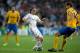 MADRID, SPAIN - OCTOBER 23: Luka Modric (L) of Real Madrid CF competes for the ball with Fernando Llorente (R) of Juventus during the UEFA Champions League Group B match between Real Madrid CF and Juventus at Estadio Santiago Bernabeu on October 23, 2013
