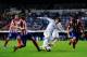 MADRID, SPAIN - SEPTEMBER 28: Alvaro Morata of Real Madrid CF duels for the ball with Filipe Luis (L) and Diego Godin of Atletico de Madrid during the La Liga match between Real Madrid CF and Club Atletico de Madrid at Bernabeu on September 28, 2013 in M