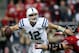 Nov 3, 2013; Houston, TX, USA; Indianapolis Colts quarterback Andrew Luck (12) looks for an open receiver during the second quarter as Houston Texans defensive end J.J. Watt (99) applies pressure at Reliant Stadium. Mandatory Credit: Troy Taormina-USA TOD