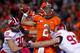 CHAMPAIGN, IL - OCTOBER 19: Nathan Scheelhaase #2 of the Illinois Fighting Illini is hit by Brendan Kelly #97 of the Wisconsin Badgers as he throws at Memorial Stadium on October 19, 2013 in Champaign, Illinois. Wisconsin defeated Illinois 56-32. (Photo b